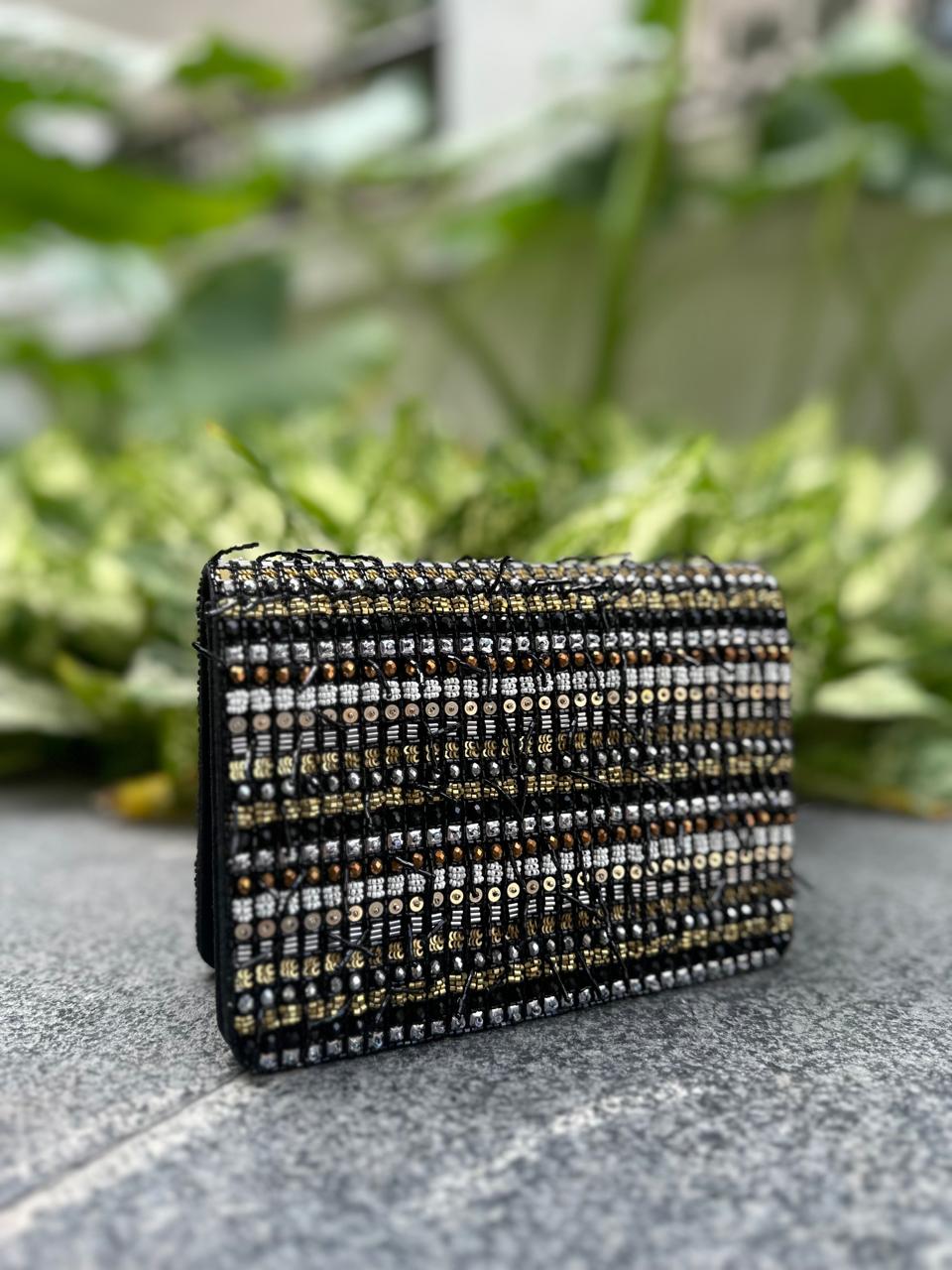 Midnight muse clutch bag